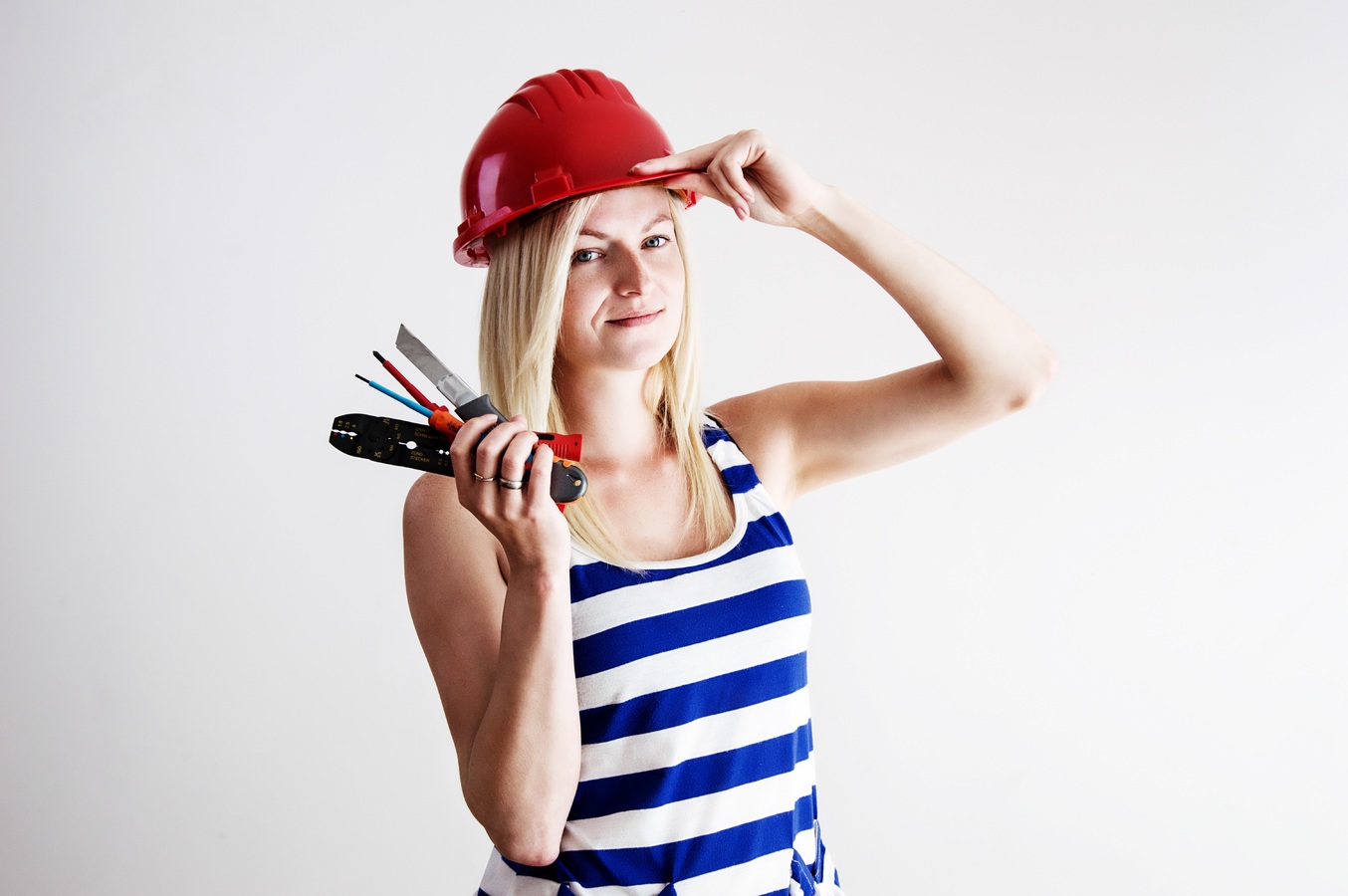 a woman holding tools
